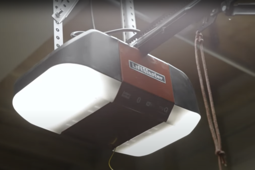 Person opening their garage door with their remote opener